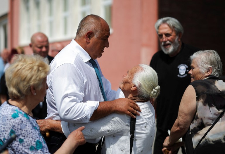 Boyko Borissov, leader of the centre-right GERB party, embraces a supporter 