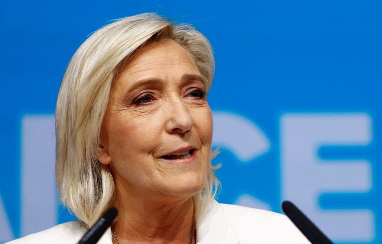 Marine Le Pen, President of the French far-right National Rally (Rassemblement National - RN) party parliamentary group, addresses party members after the polls closed during the European Parliament elections