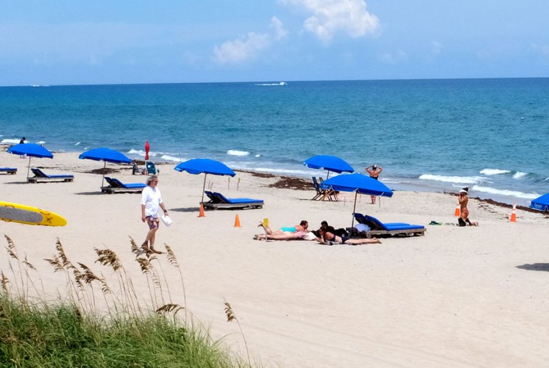 Waters and beach areas along Florida's coastal areas are displaying red flag warnings about dangerous water conditions, including rip currents, which claimed five lives in two days. File Photo by Gary I Rothstein/UPI