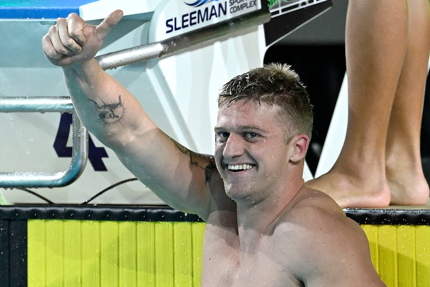 Sam Williamson smiles after his swim and holds up his thumb