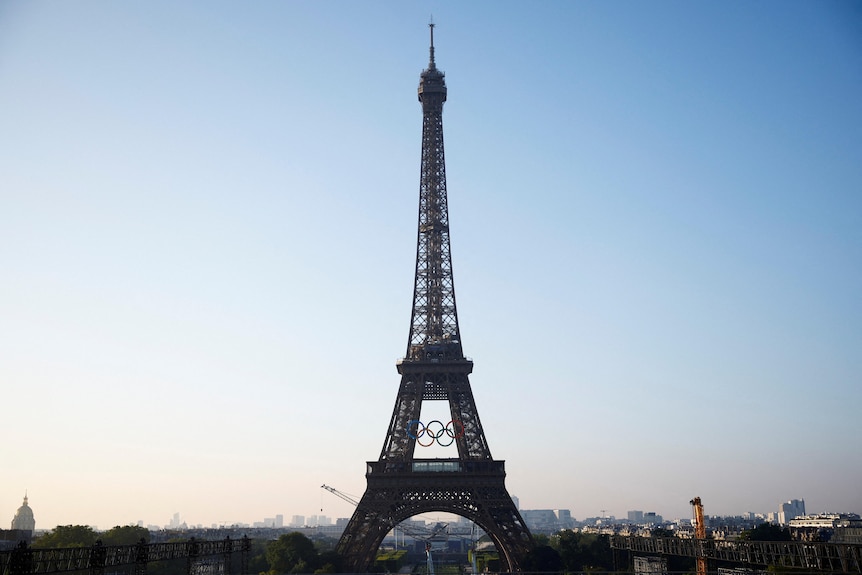 The Olympic rings are displayed on the first floor of the Eiffel Tower.