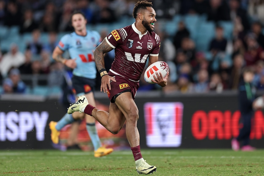 Hamiso Tabuai-Fidow runs to the line to score a try in State of Origin I.