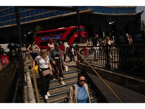 A shoppers walk to the Underground Oxford Circus Station in central London, UK, on Friday, May 10, 2024. The UK's economy bounced back strongly from a shallow recession at the end of last year, providing some relief for Prime Minister Rishi Sunak who has so far struggled to deliver on his promise to revive growth. Photographer: Jose Sarmento Matos/Bloomberg