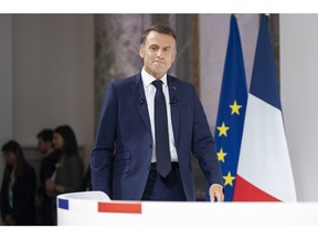 Emmanuel Macron arrives for a news conference in Paris on June 12.