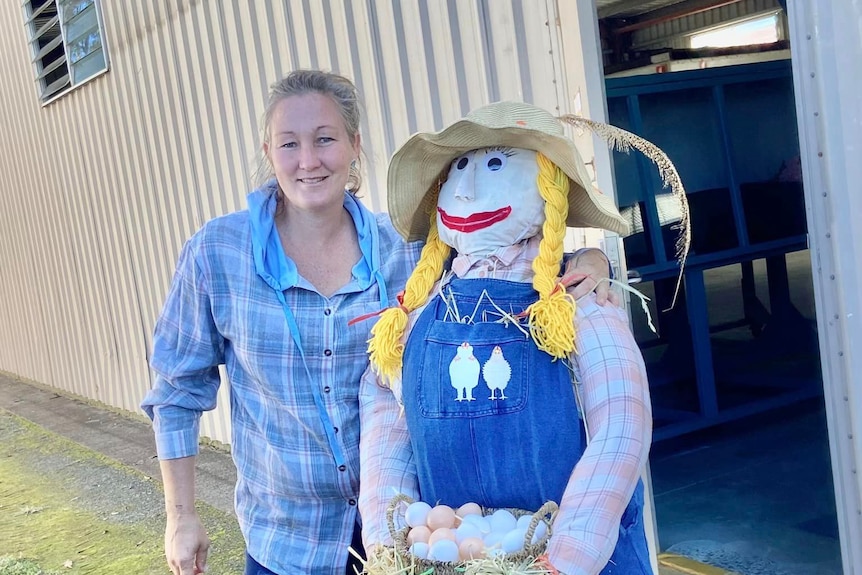 Emma Morgan with a scarecrow