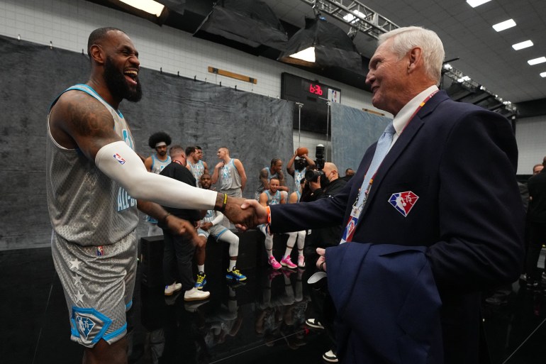 Basketball players shake hands.