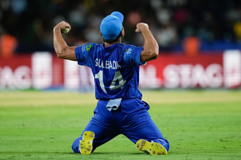 Afghanistan's Gulbadin Naib celebrates after defeating Australia by 21 runs in their men's T20 World Cup cricket match at Arnos Vale Ground, Kingstown, Saint Vincent and the Grenadines, Saturday, June 22, 2024. (AP Photo/Ramon Espinosa)