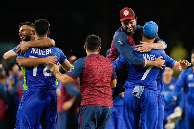 Afghanistan players celebrate after defeating Australia by 21 runs in their men's T20 World Cup cricket match at Arnos Vale Ground, Kingstown, Saint Vincent and the Grenadines, Saturday, June 22, 2024. (AP Photo/Ramon Espinosa)