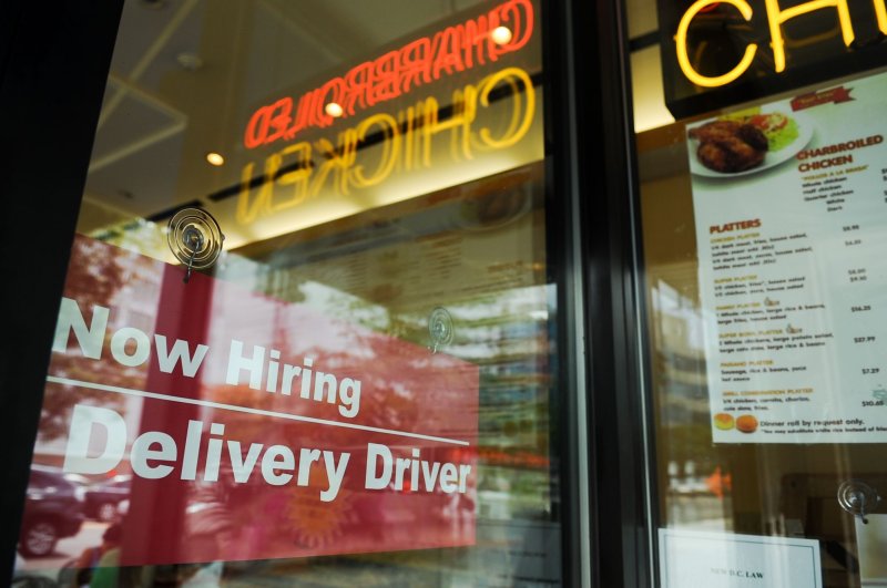 A "now hiring" sign is displayed in the window of a restaurant in the Tenlytown neighborhood of Washington D.C, on August 12, 2010. Job openings dropped slighting in the United States in April, according to the Labor Department. File Photo by Alexis C. Glenn/UPI