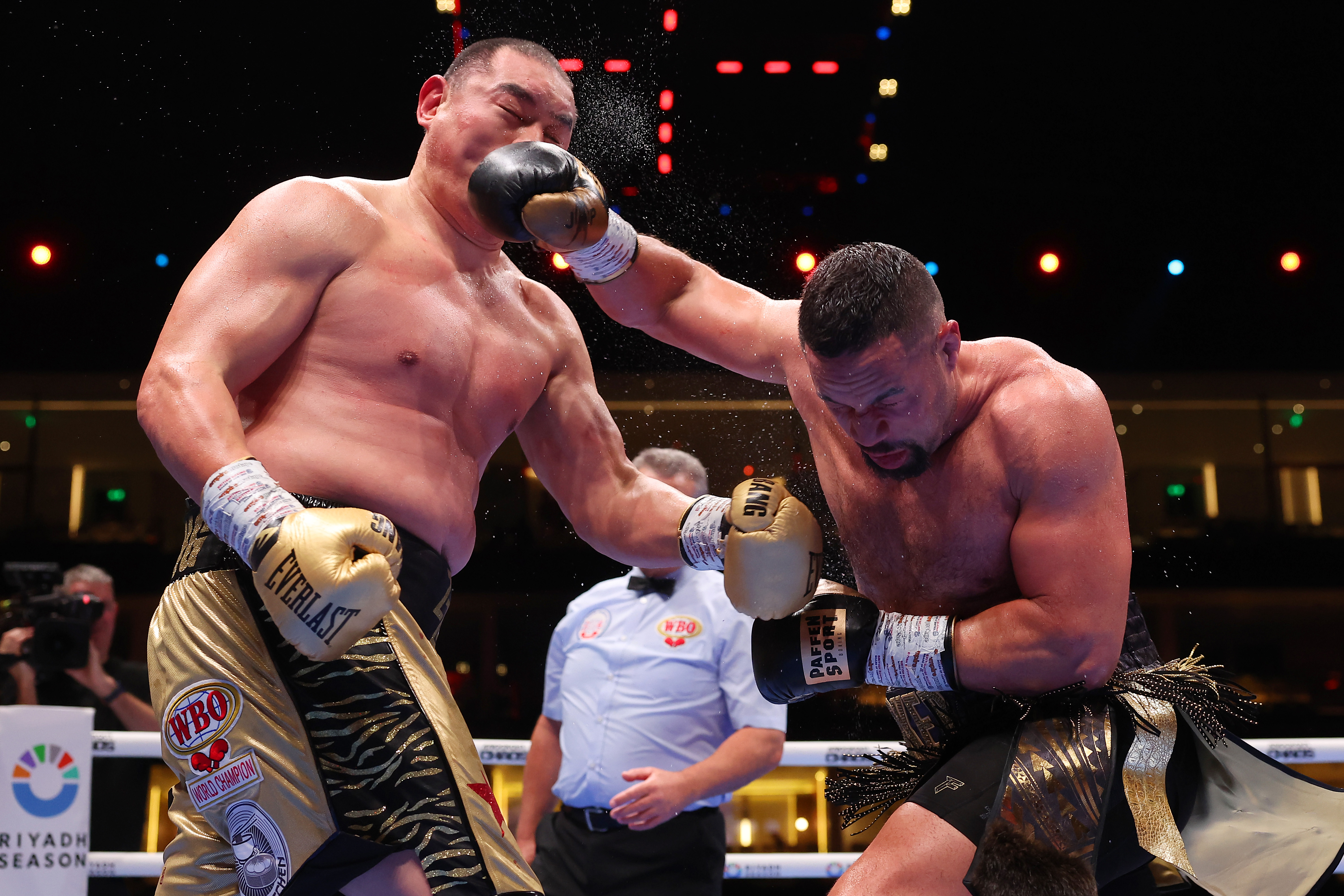 Zhilei Zhang and Joseph Parker exchange punches during their fight in March