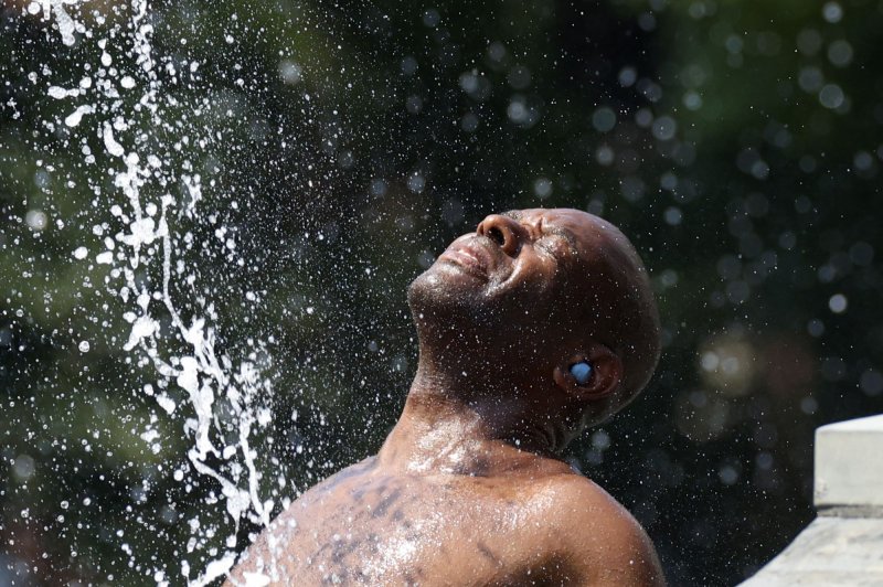 A person cools off in the fountain at Washington Square Park in New York City on Wednesday, June 19, 2024. An excessive heat watch is set for Friday through Sunday across large parts of New York and New Jersey as the heat index approaches 105 degrees. Photo by John Angelillo/UPI