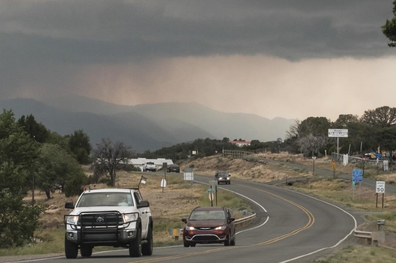 View of smoke from the South Fork Fire as seen Wednesday from Capitan, New Mexico. The wildfires, which ignited Monday, have killed one man, destroyed 1,400 structures and led to the evacuation of the entire village of Ruidoso. Photo by Ramsay de Give/EPA-EFE/