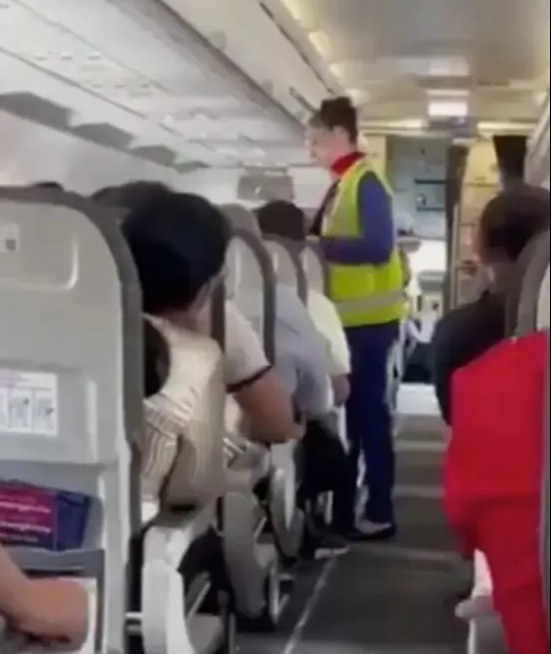 Footage shows airline staff instructing the child and his dad to get off the plane