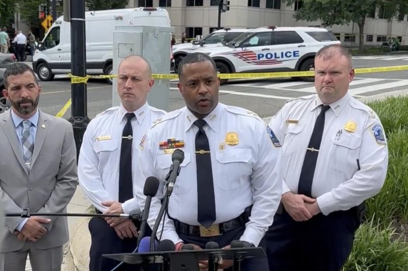 Assistant Chief Darnel Robinson, of the D.C. Police Department, speaks to reporters Monday after a woman was killed when the vehicle she was riding in was carjacked and crashed into the U.S. attorney's building. "The suspect was captured and placed under arrest." Photo courtesy of DC Police Department