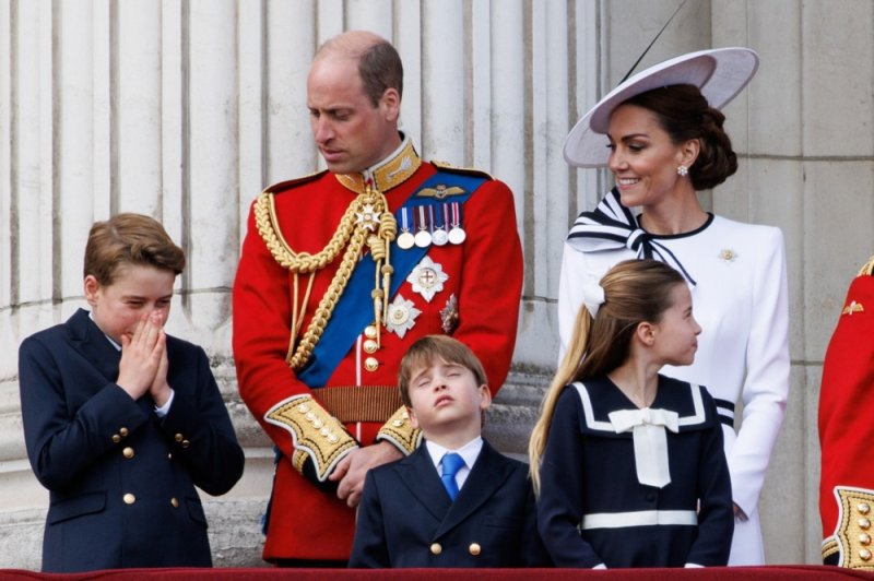 Britain's Prince George (from left), William Prince of Wales, Prince Louis, Princess Charlotte and Catherine Princess of Wales watch a flypast on the balcony of Buckingham Palace following the annual Trooping the Colour parade in London, Britain, on Saturday. Photo by Tolga Akman/EPA-EFE