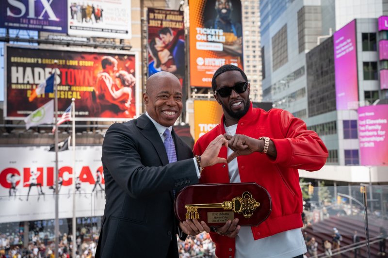 Rap mogul Sean 'Diddy' Combs, right, has returned a ceremonial key to New York City after recently revealed video footage showed him assaulting singer Cassie Ventura, his former girlfriend. Photo courtesy of Mayor Eric Adams/Twitter