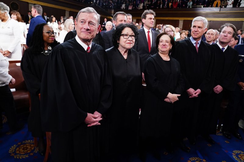 Chief Justice of the Supreme Court John Roberts along with Associate Justices Sonia Sotomayor, Elena Kagan, Neil Gorsuch, and Brett Kavanaugh stand before President Joe Biden as he delivers the State of the Union speech to a joint session of Congress at the U.S. Capitol in Washington, D.C., on March 7. File Pool photo by Shawn Thew/UPI