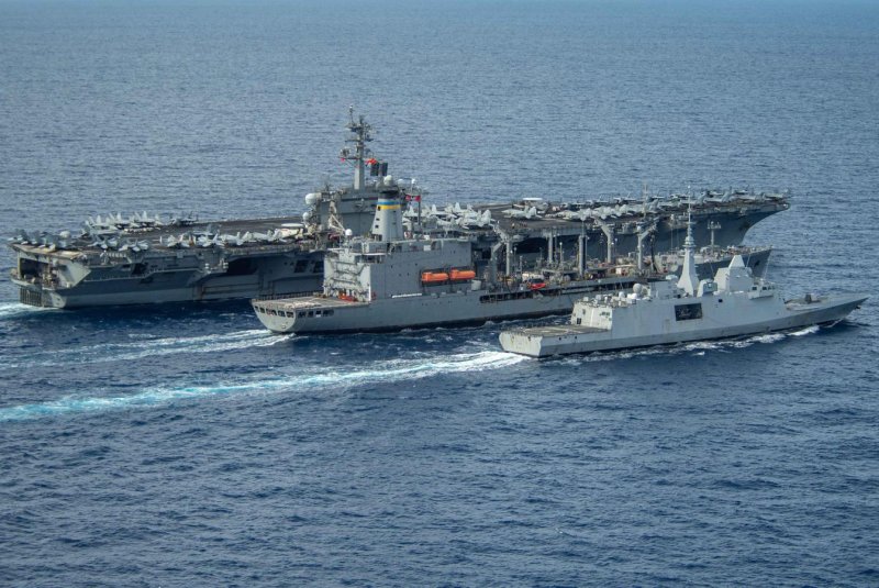 The Nimitz-class aircraft carrier USS Theodore Roosevelt (CVN 71) conducts a refueling-at-sea with the Military Sealift Command fleet replenishment oiler USNS Big Horn (middle) and the French Navy Aquitaine-class frigate FS Bretagne on June 6 befor heading to Soith Korea. Photo by Mass Communication Specialist Seaman apprentice Aaron Haro Gonzalez/U.S. Navy