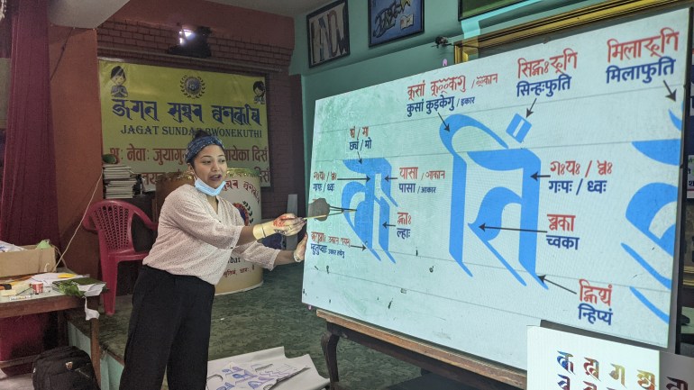 Sunita Dangol explains Ranjana alphabets at a workshop