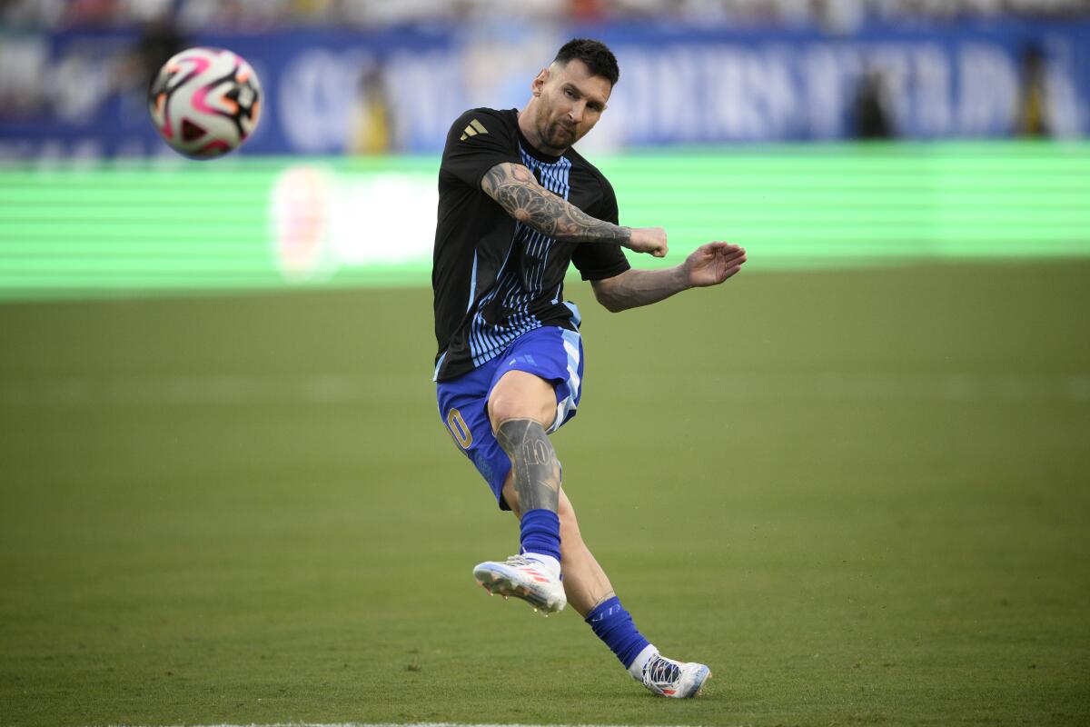 Argentina forward Lionel Messi warms up before an international friendly against Guatemala on June 14.