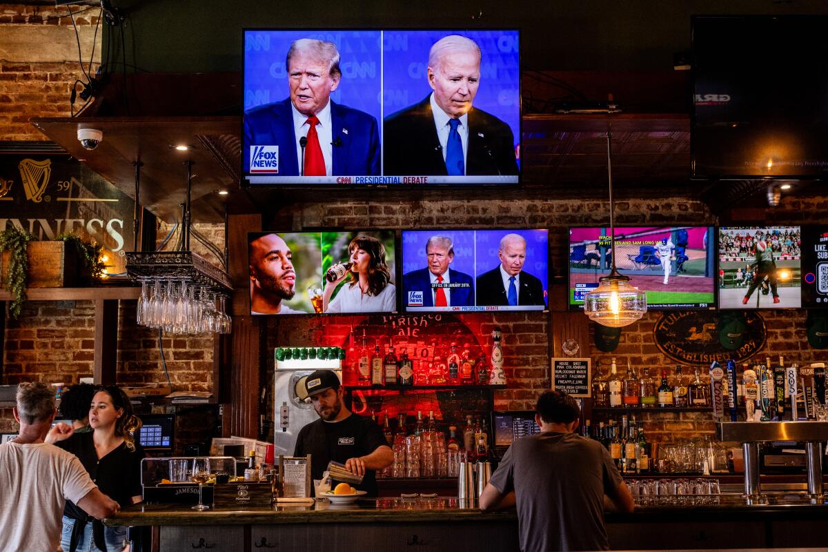 The crowd is sparse inside Patrick Molloy's on Pier Plaza in Hermosa Beach  for the  presidential debate on June 27. 