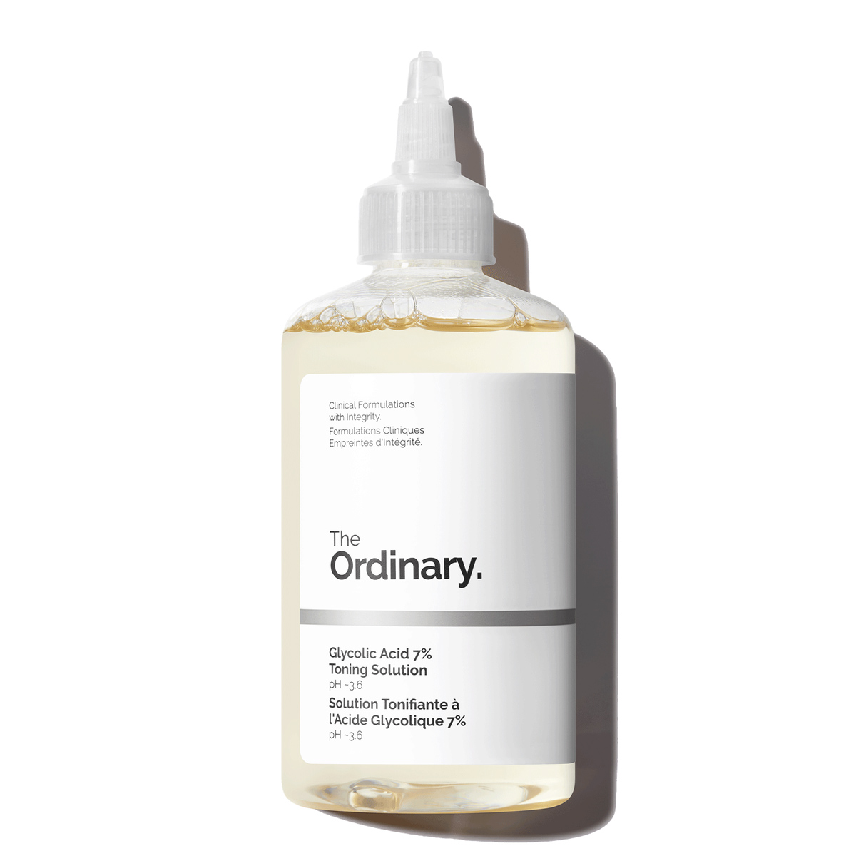 She puts The Ordinary's Glycolic Acid Toning Solution in a spray bottle before lotioning up her legs