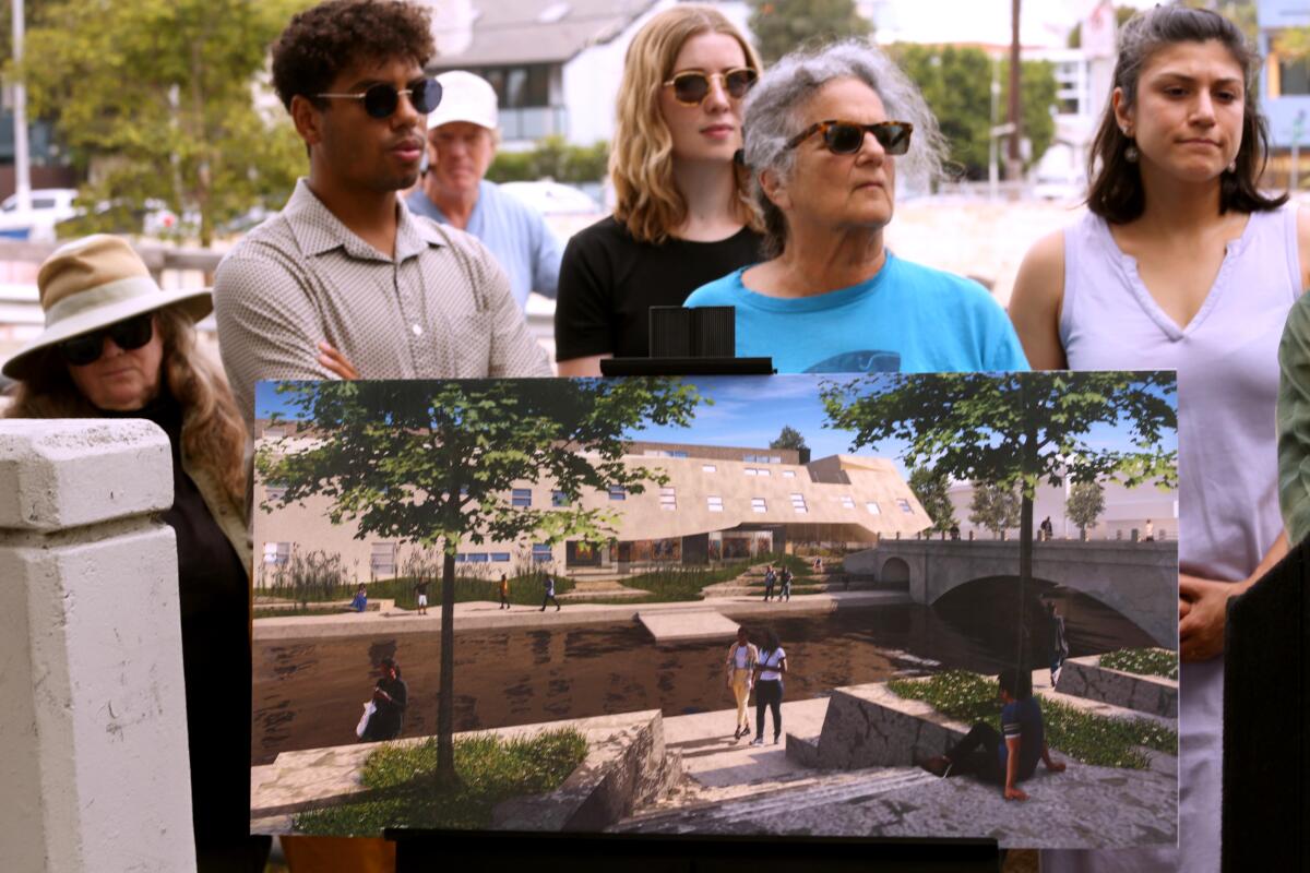 Venice residents join attorneys with LA Forward Institute and Western Center for Law and Poverty at a news conference.