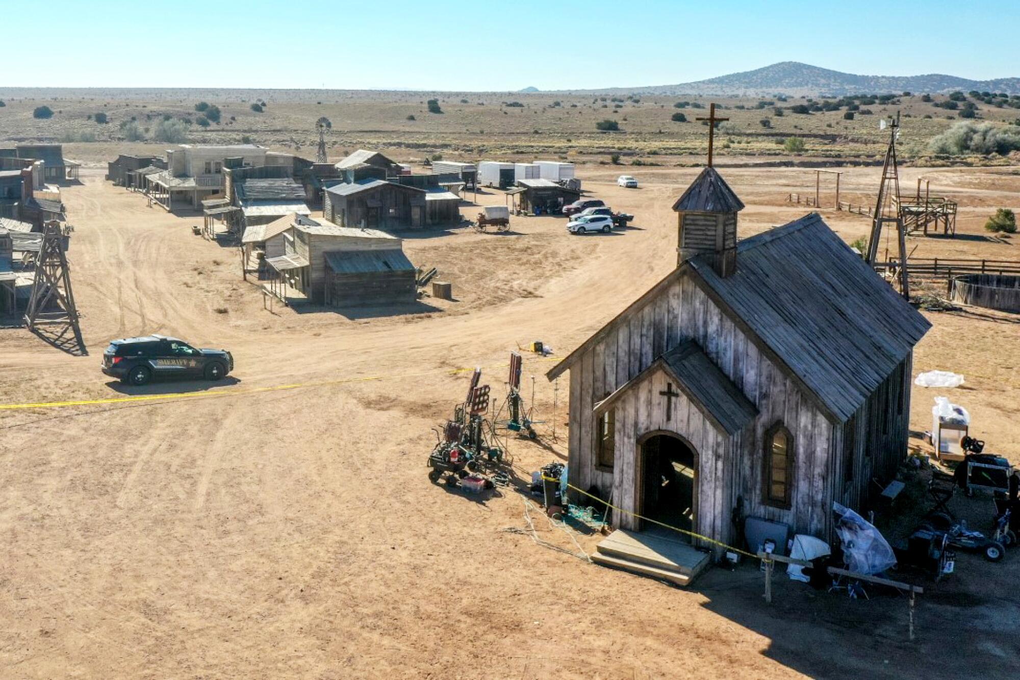 The set of "Rust" at Bonanza Creek Ranch has several buildings and vehicles nearby.