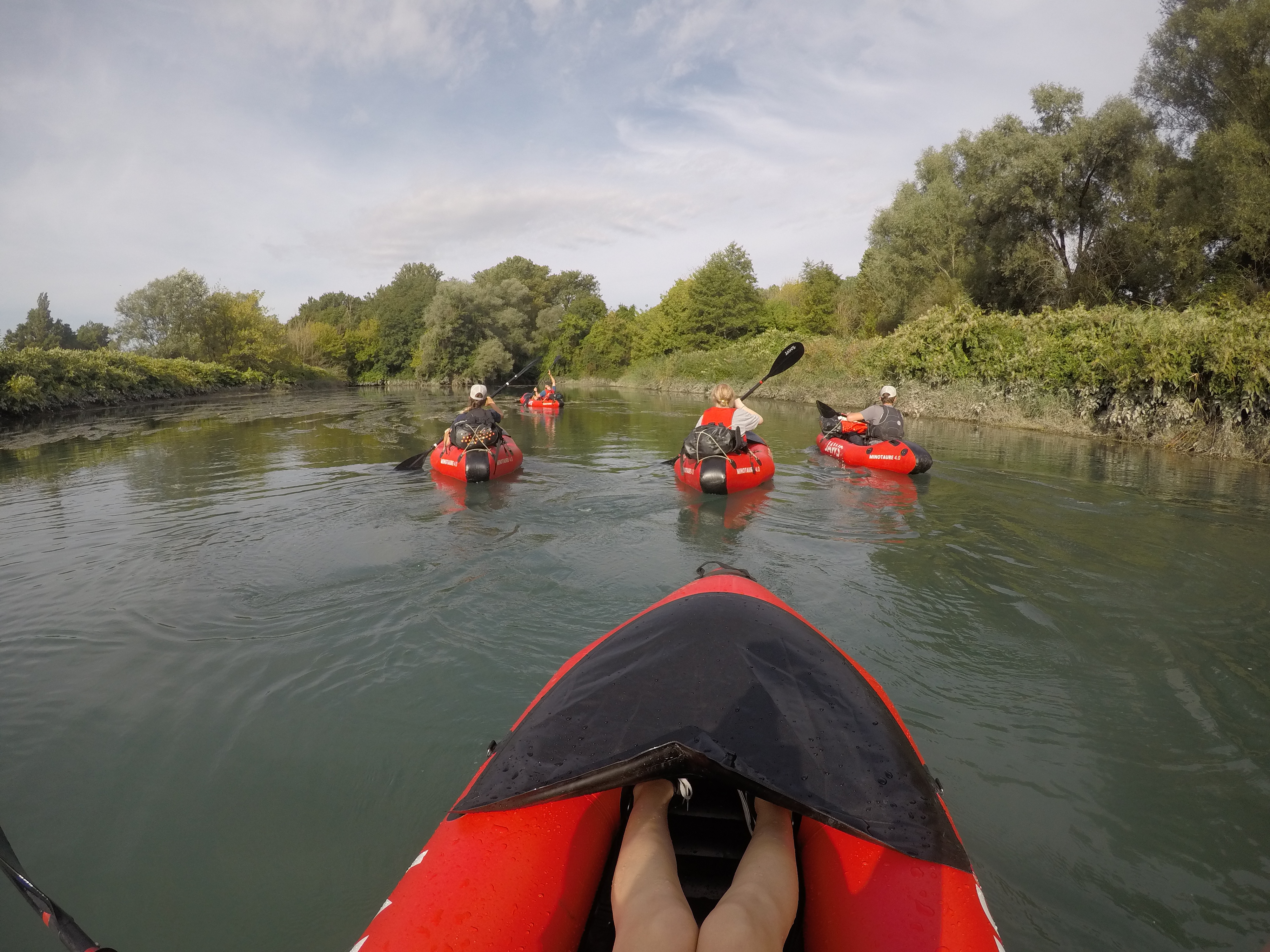 Packrafting down the Rhone before quickly packing up the raft and hopping back onto the bike for the next section of our journey