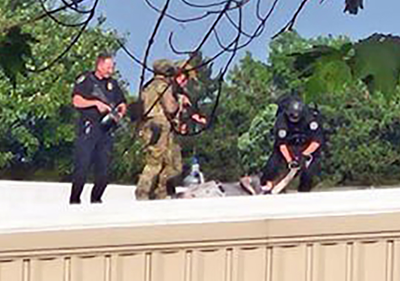 Police surround the suspected gunman behind the Trump rally shooting