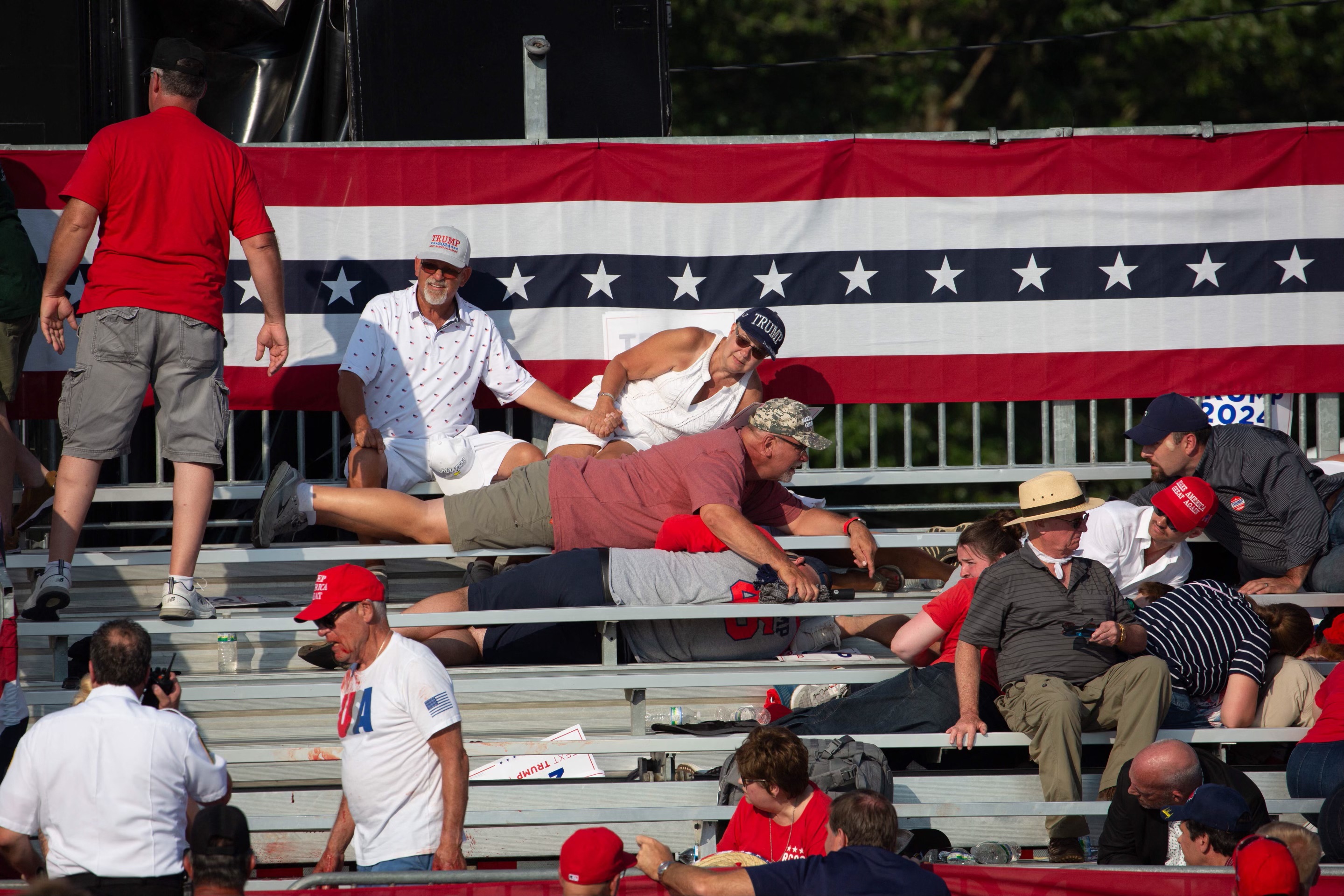 Supporters in the crowd ducked for cover in the stands