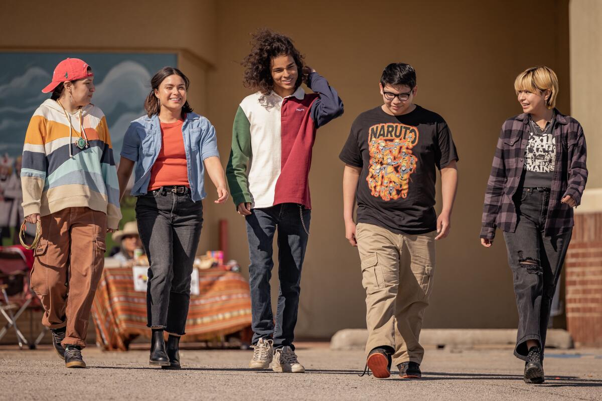 A group of teenagers laugh among themselves in "Reservation Dogs."