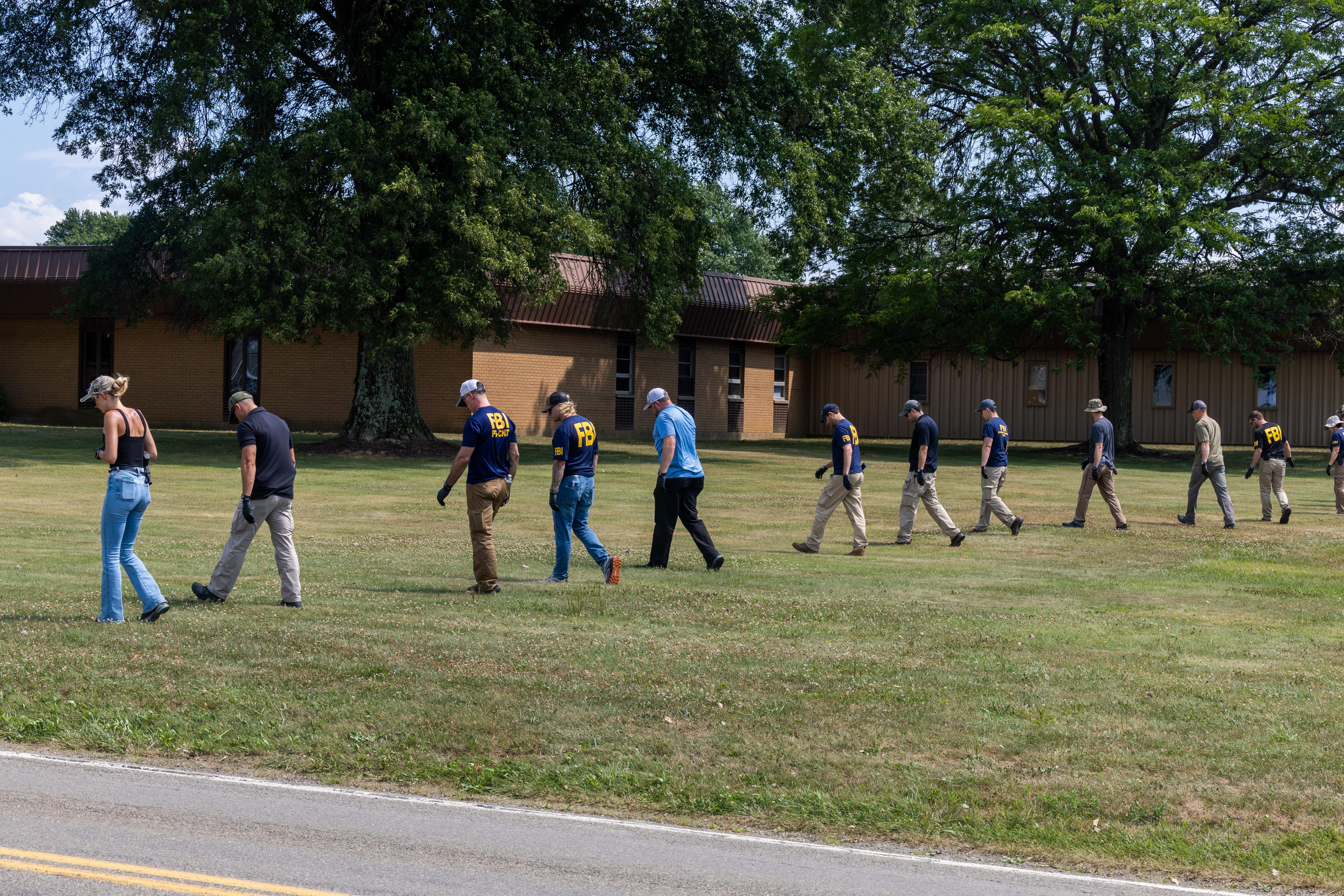 Members of FBI seen searching for evidence around the area Thomas Crooks climbed onto a roof and fired a weapon towards a Trump