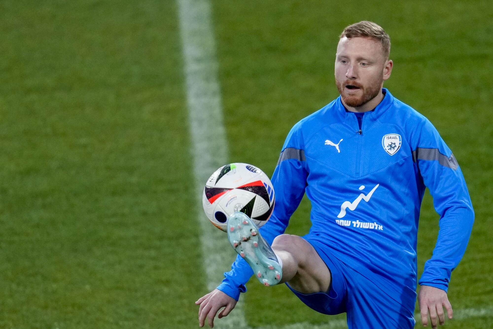 Israel soccer player Ido Shahar controls the ball during a training session in March.