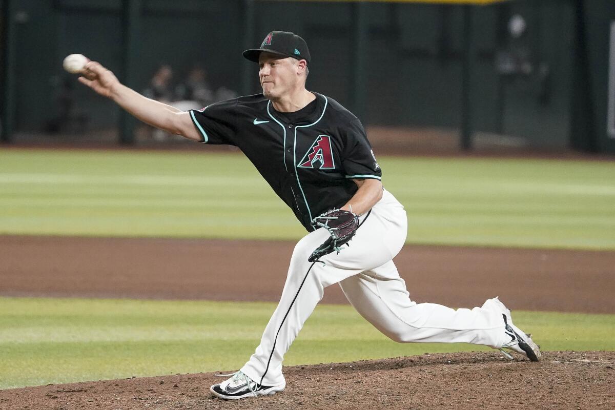 Arizona Diamondbacks pitcher Paul Sewald delivers during a game.