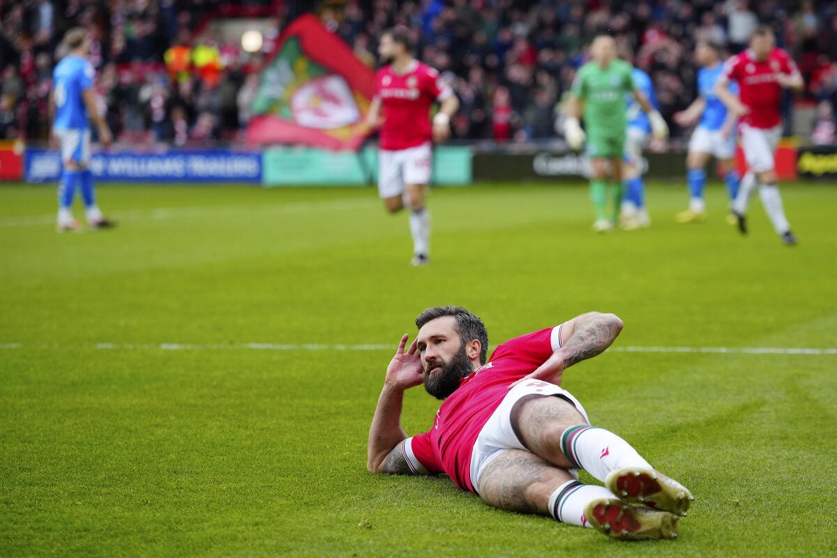 Wrexham's Ollie Palmer celebrates after scoring a goal during an English League Two soccer match 