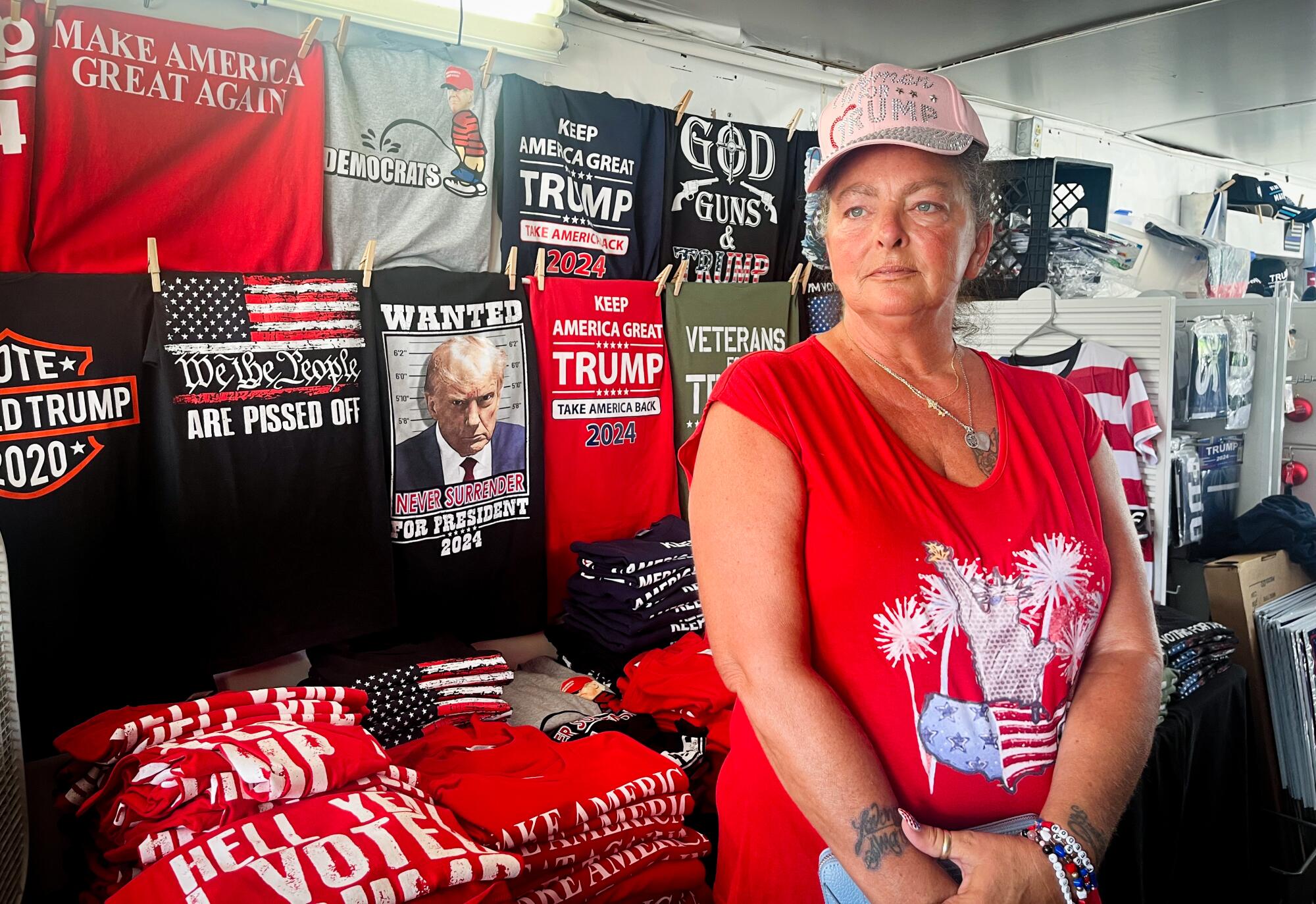 A woman in a T-shirt shop.