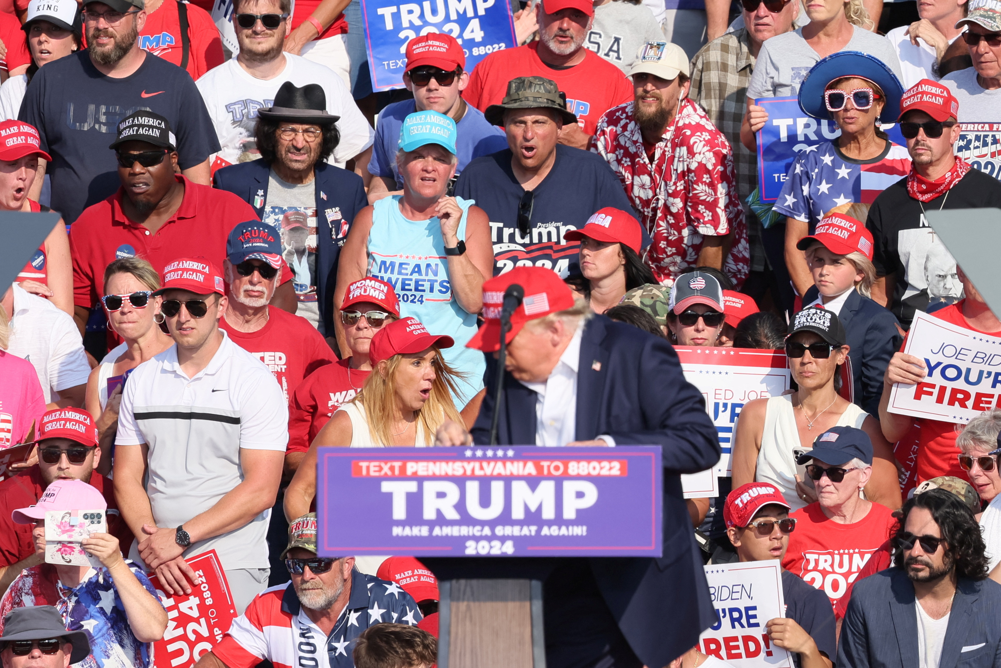 Bizarre conspiracy theories have emerged, including one that claims that the woman pictured right of Trump was a stooge