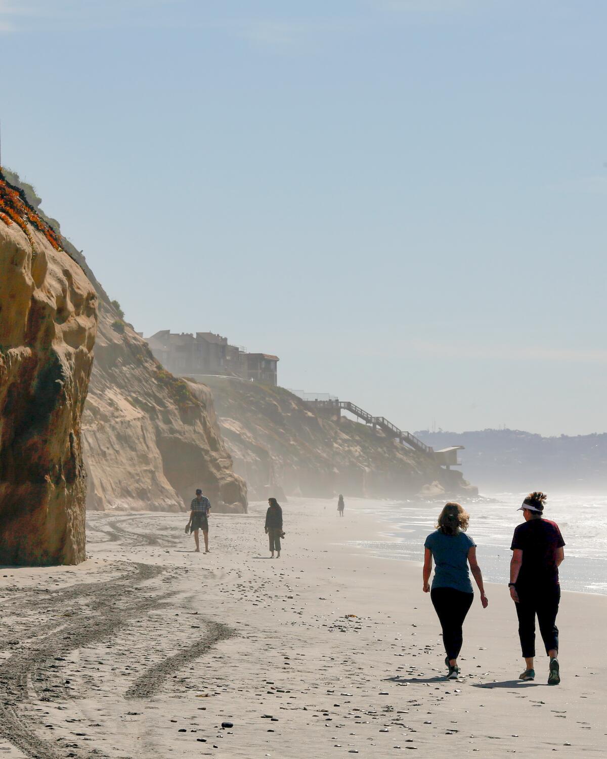 People spend time at Fletcher Cove in Solana Beach, California.