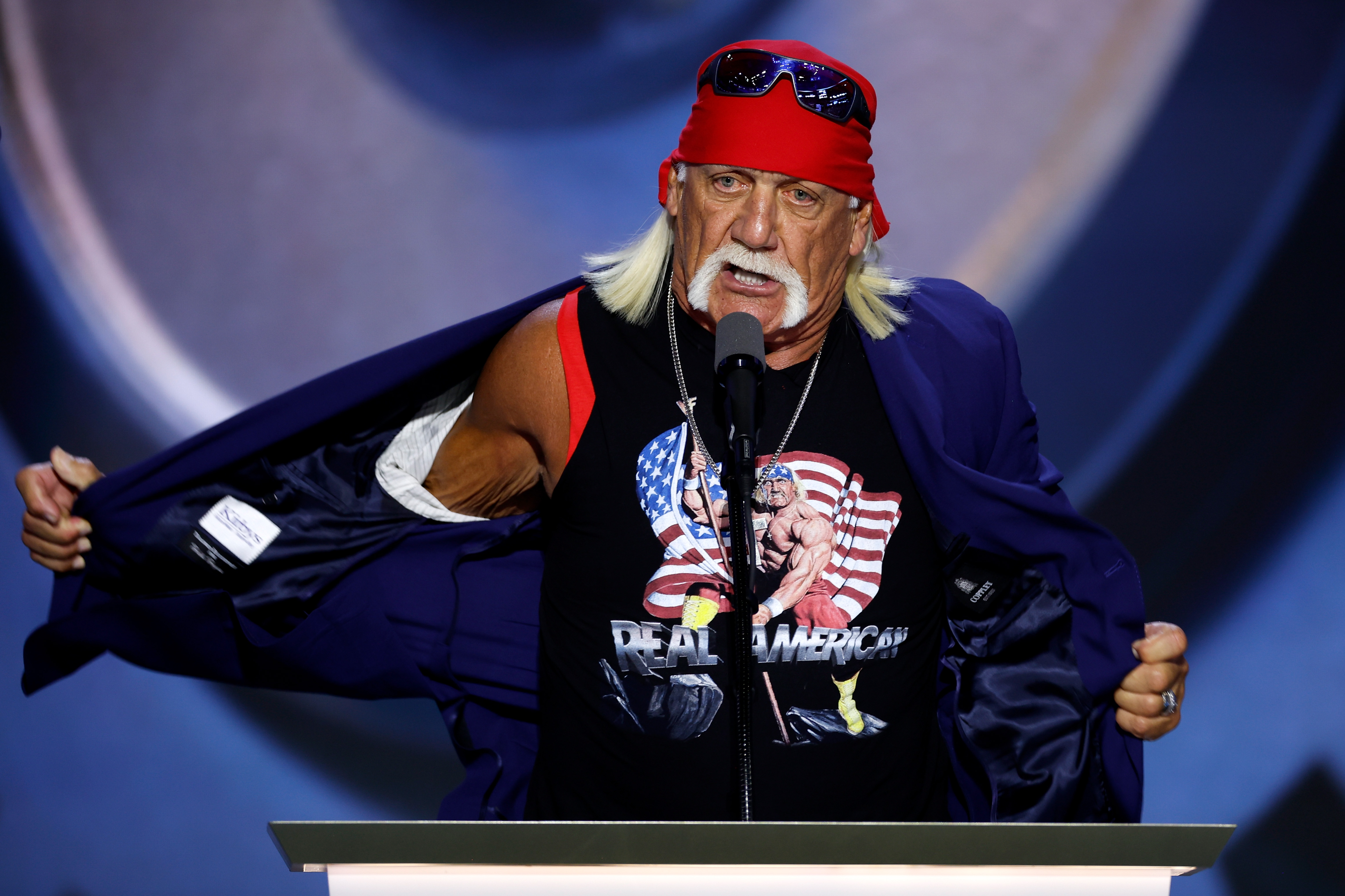 Professional entertainer and wrestler Hulk Hogan removes his jacket as he speaks on stage on the fourth day of the Republican National Convention