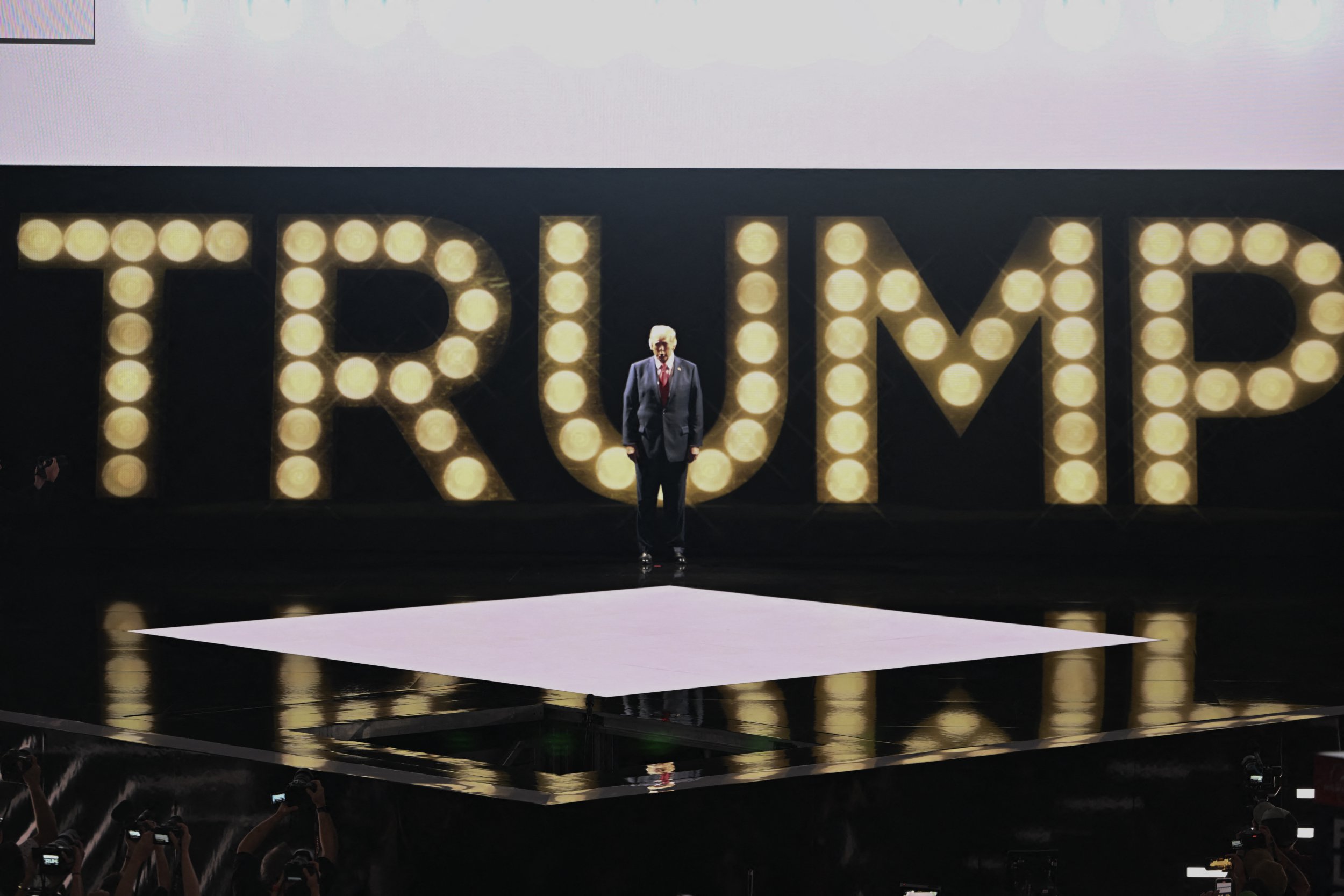 Trump appeared in front of a lit up sign to address the nation for the first time since his assassination attempt