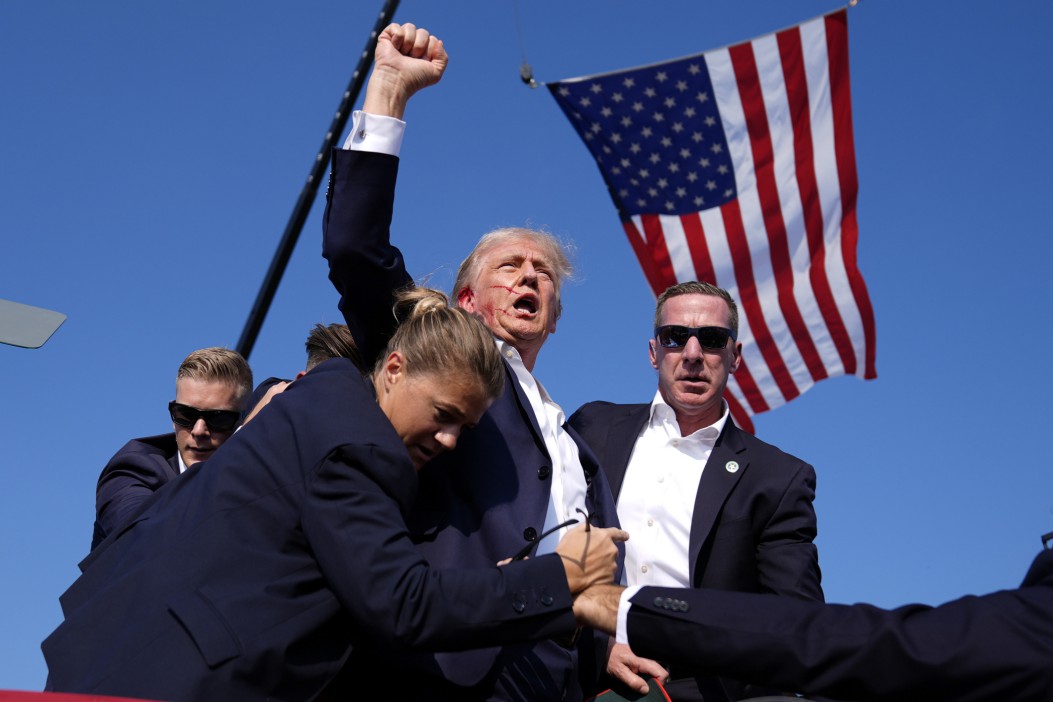 Secret Service ushered Trump off the stage after a bullet grazed his ear