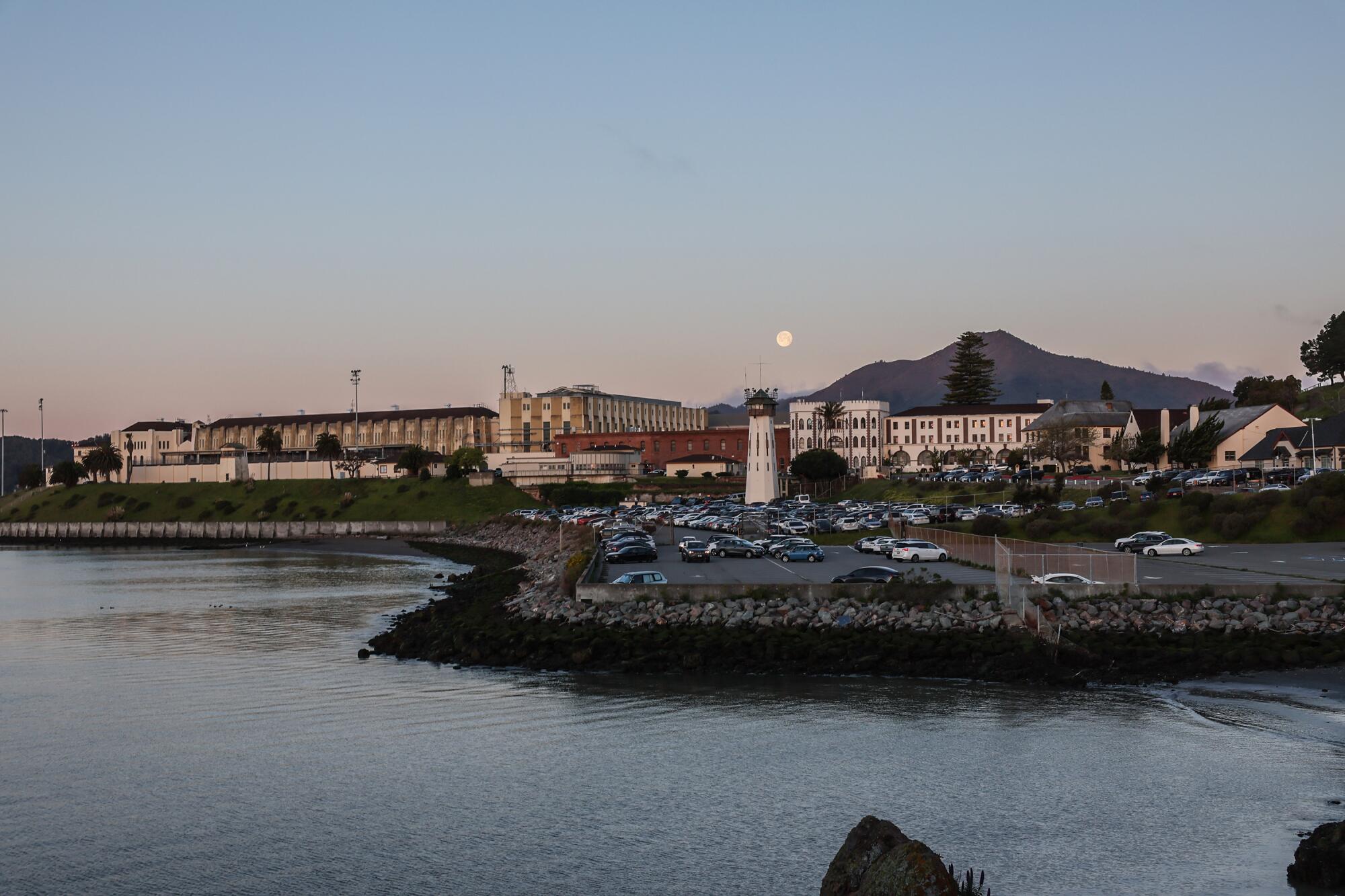 The imposing walls of San Quentin state prison loom over San Francisco Bay.   