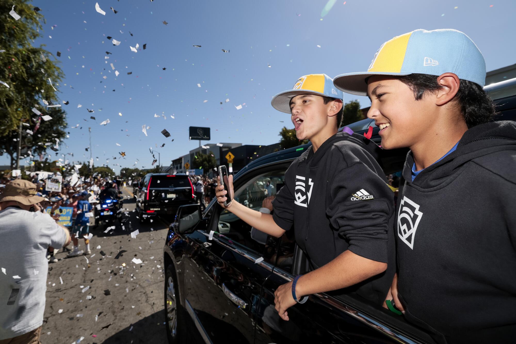 El Segundo Little League players take part in a victory parade along main street in El Segundo on Aug. 28, 2023.