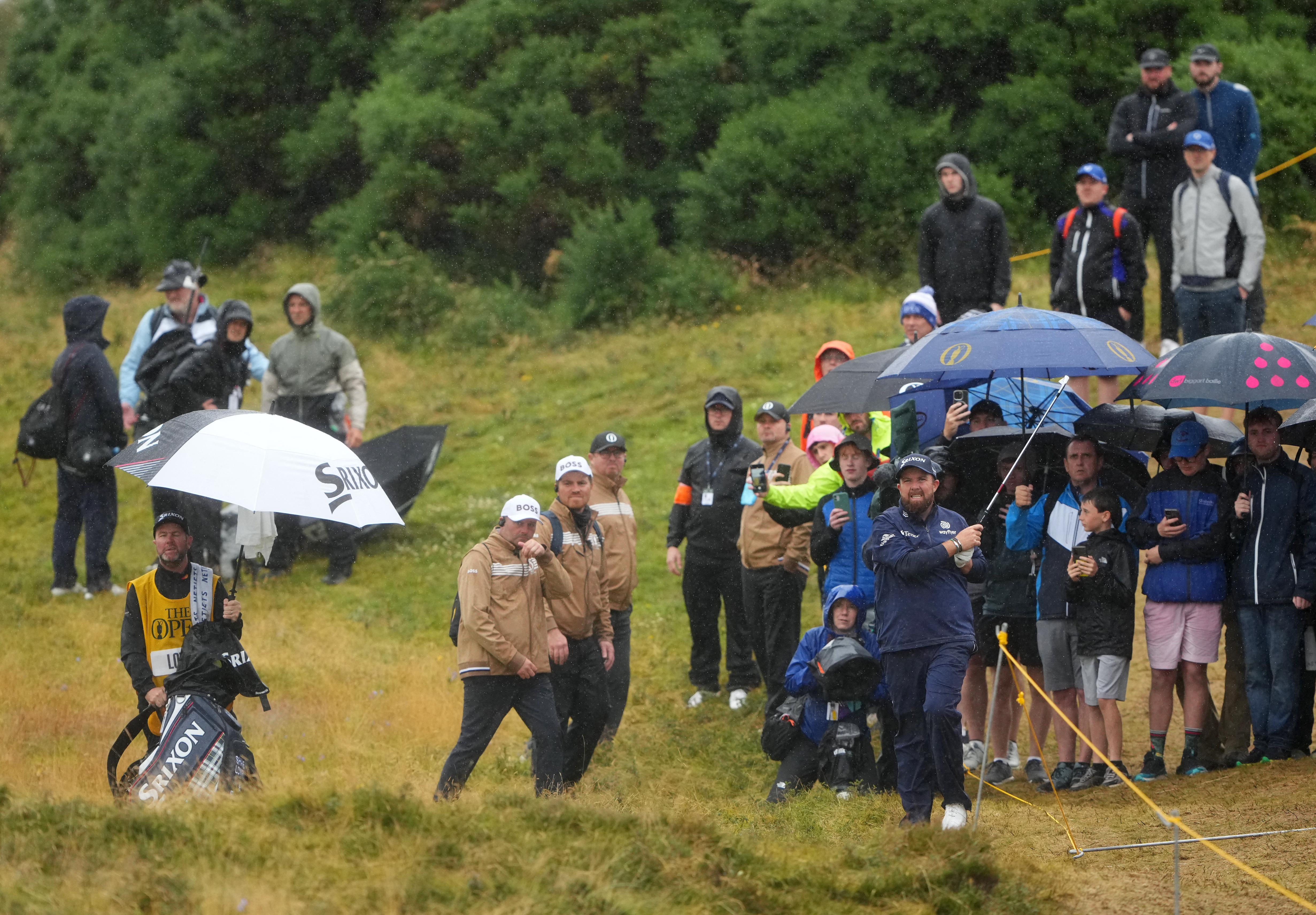 Shane Lowry still looked jolly with a brolly high on the leaderboard