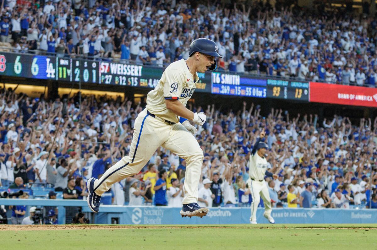 Dodgers catcher Will Smith celebrates after hitting a walk-off single in the 11th inning at Dodger Stadium.