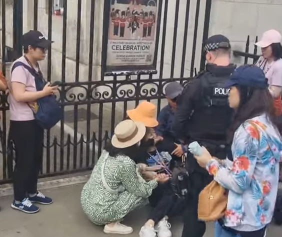 She then appears to faint and is later seen sitting on the floor against the railings