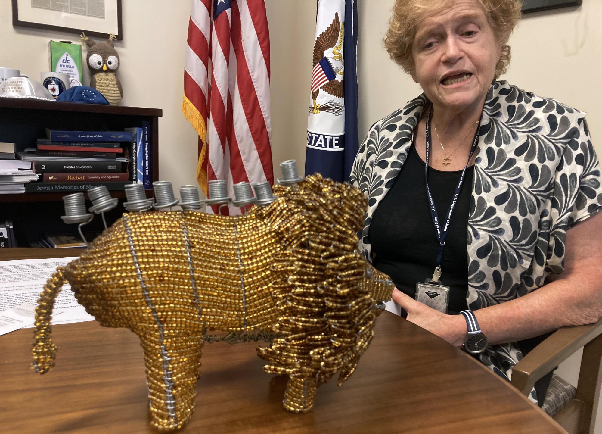 Deborah Lipstadt speaks in her office with a statue on her desk