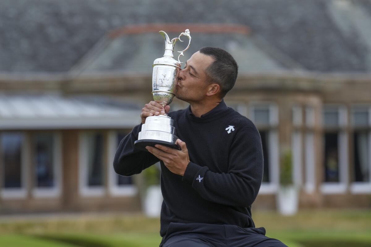 Xander Schauffele kisses the Claret Jug trophy after winning the British Open on Sunday in Troon, Scotland.