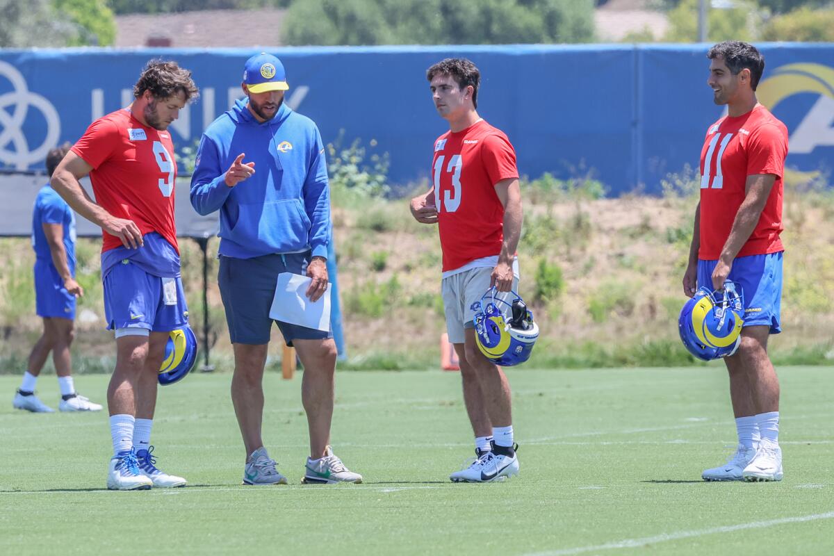 Rams quarterbacks coach Dave Ragone talks with Matthew Stafford, Stetson Bennett and Jimmy Garoppolo